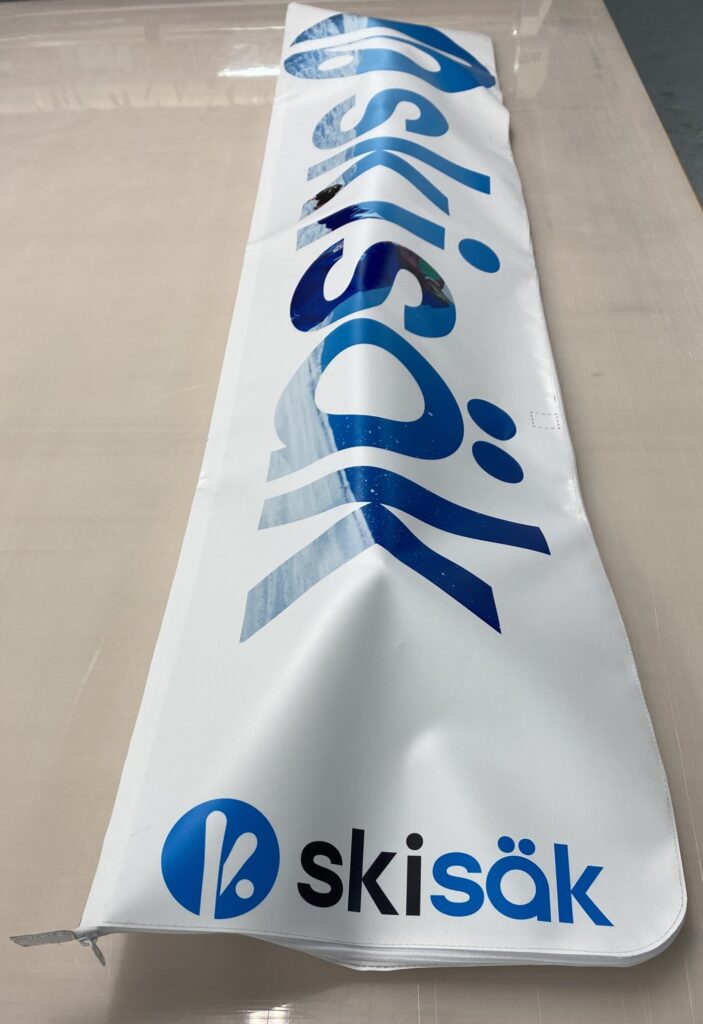 Sac Skisäk blanc et bleu avec le logo Skisäk